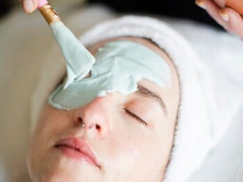 marine algae facial mask being applied to a young woman at our spa