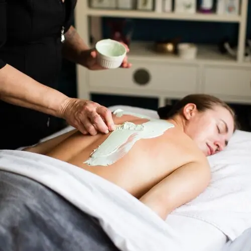 Back Facial Being Performed on a Young Woman