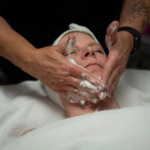 Cleansing Facial Process Being Applied to a Woman