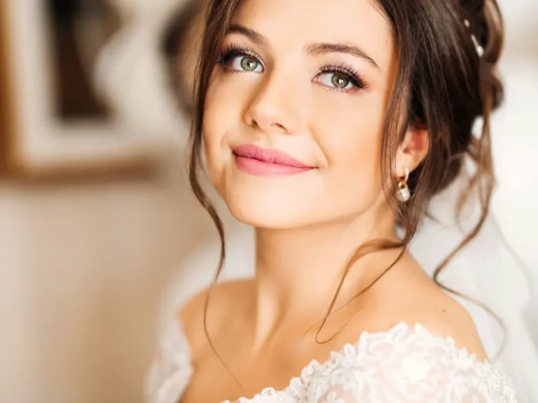 Smiling Bride Showing Off Her Fresh Makeup