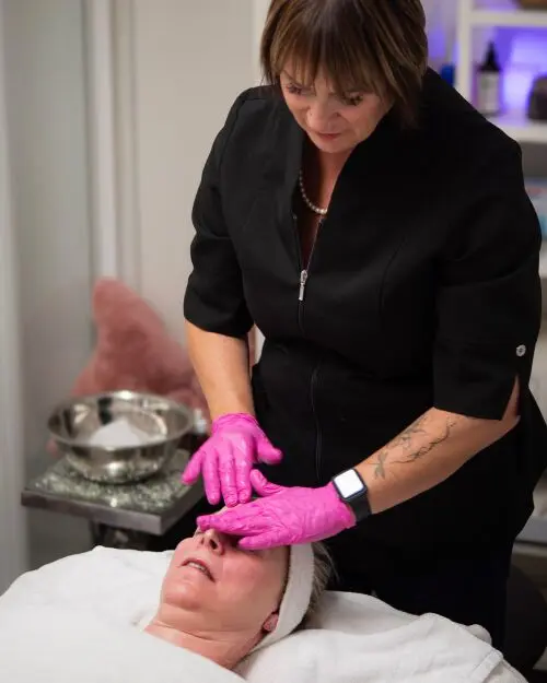 Woman Receiving a Skin Moisturizing Facial from Kim